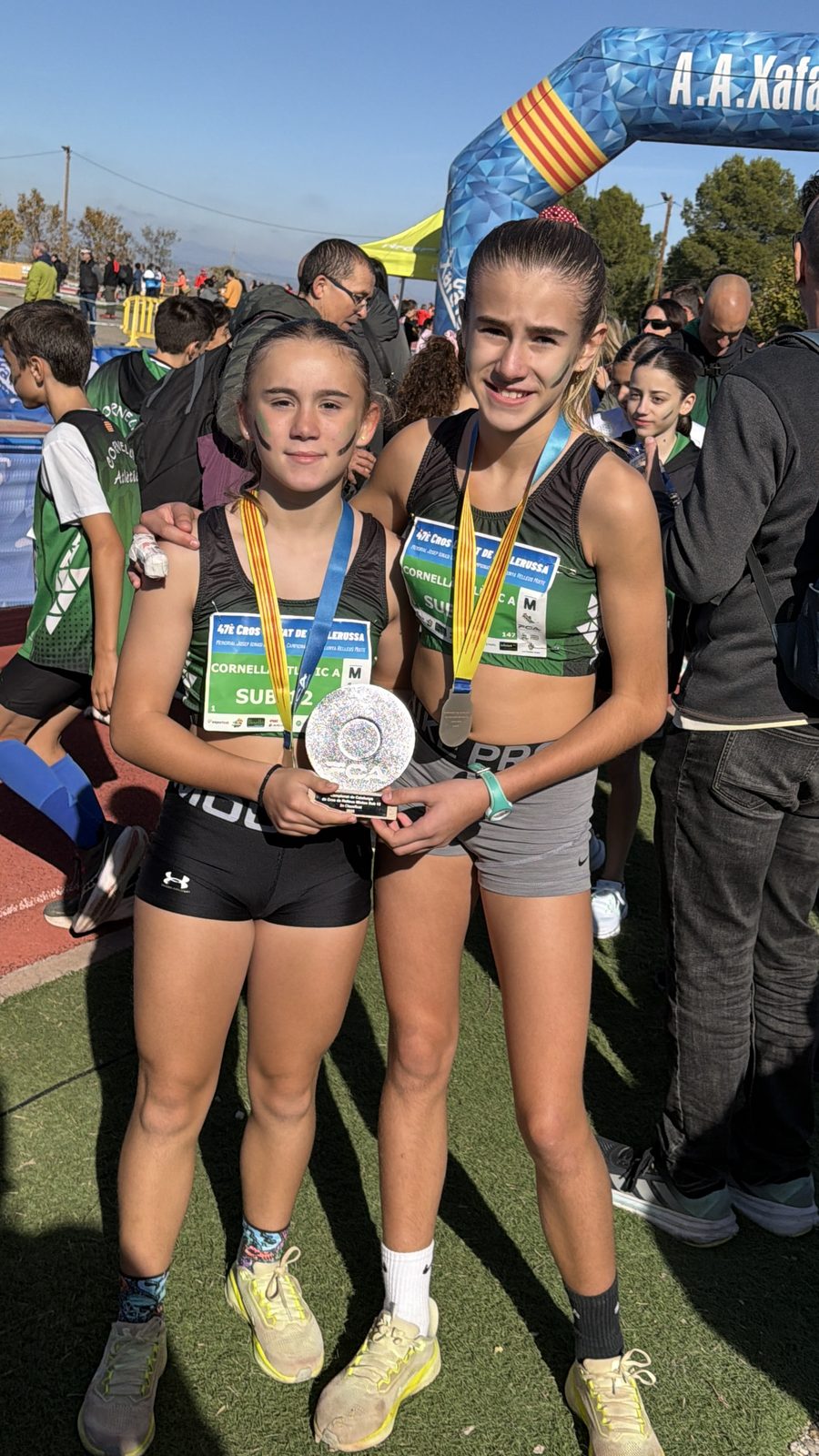 Claudia with teammates and medals